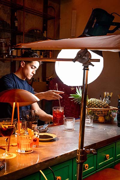 Behind the scenes of a bartender making a cocktail.